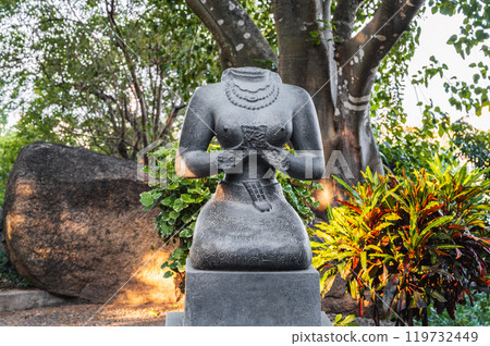 Buddhist statue of a female deity in park at pagoda in Vietnam 119732449