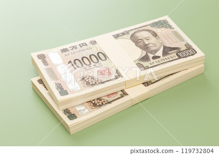 A stack of 10,000 yen bills on a green background 119732804