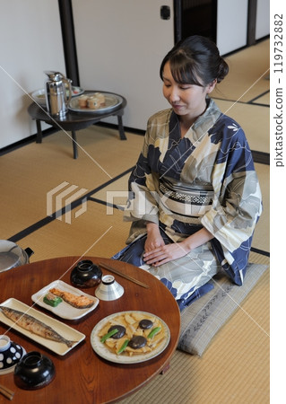 Young women sitting at a round table in the Showa era Young women sitting at a round table in the Showa era 119732882
