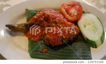 Ayam Goreng Balado is Indonesian favorite with fried chicken and spicy balado paste. Originating from West Sumatra, this dish offers a fiery and flavorful experience. Served with rice and veggies. 119733100