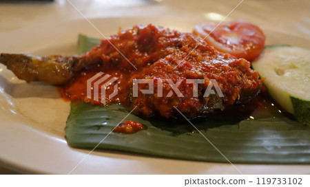 Ayam Goreng Balado is Indonesian favorite with fried chicken and spicy balado paste. Originating from West Sumatra, this dish offers a fiery and flavorful experience. Served with rice and veggies. 119733102