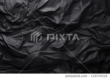 Crumpled black paper texture background. 119734328