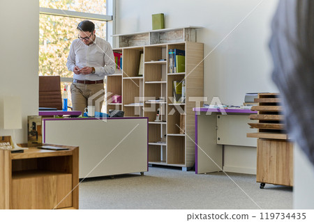 Modern Office Interior with Wooden Furniture, Conference Table, and Computers Modern Office Interior with Wooden Furniture, Conference Table, and Computers 119734435