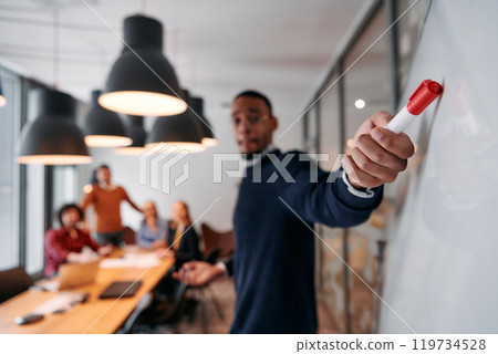 Strategic Leadership: African American Businessman Leading Crucial Corporate Meeting. Strategic Leadership: African American Businessman Leading Crucial Corporate Meeting. 119734528