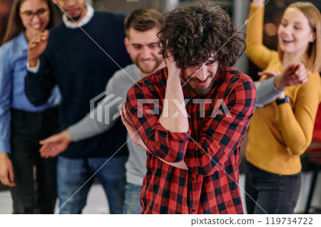 A group of young business people have fun playing interesting games while taking a break from work in a modern office. Selective focus  119734722