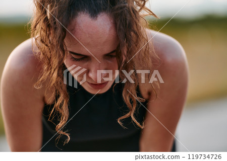 Woman Resting After Intense Run 119734726