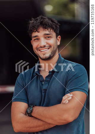 Portrait of a young successful entrepreneur in front of the company 119735168