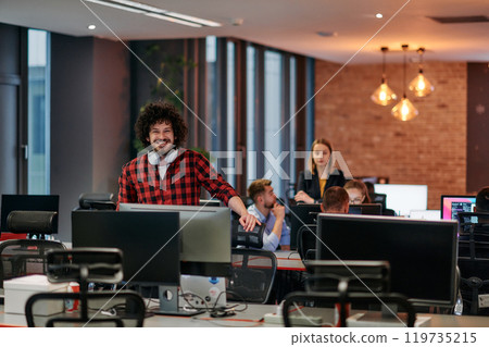 Strategic Business Meeting: Group of Professionals Collaborating in Office Using Computers 119735215