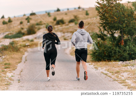 A Couple's Energizing Morning Run in the Mountains 119735255