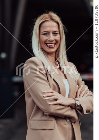 A powerful portrait of a businesswoman, standing confidently with her arms crossed, representing the determination of the female gender and embodying strength and success A powerful portrait of a businesswoman, standing confidently with her arms crossed, representing the determination of the female gender and embodying strength and success 119735586