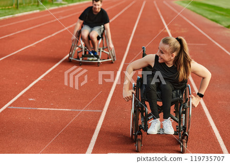 An inspiring couple with disability showcase their incredible determination and strength as they train together for the Paralympics pushing their wheelchairs in marathon track  119735707