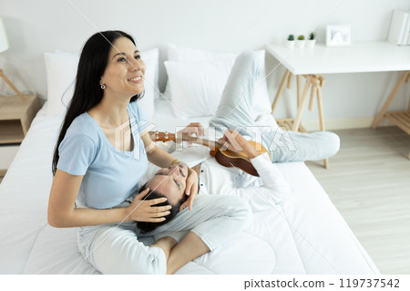 happy man woman couple romantic lying together lover on bed. 119737542