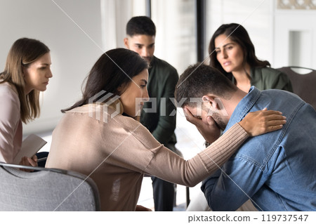 Latin counsellor giving support to tired depressed patient Latin counsellor giving support to tired depressed patient 119737547