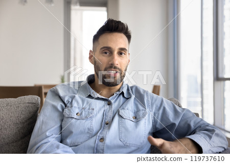 Handsome Latin blogger man filming self video for vlog Handsome Latin blogger man filming self video for vlog 119737610