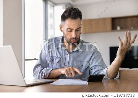 Worried Latin homeowner man finding money loss, financial problem Worried Latin homeowner man finding money loss, financial problem 119737738