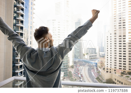 Excited successful homeowner enjoying being in new apartment Excited successful homeowner enjoying being in new apartment 119737886