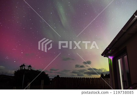The Aurora Borealis, the northern lights, showing up above bungalow in County Donegal, Ireland The Aurora Borealis, the northern lights, showing up above bungalow in County Donegal, Ireland 119738085