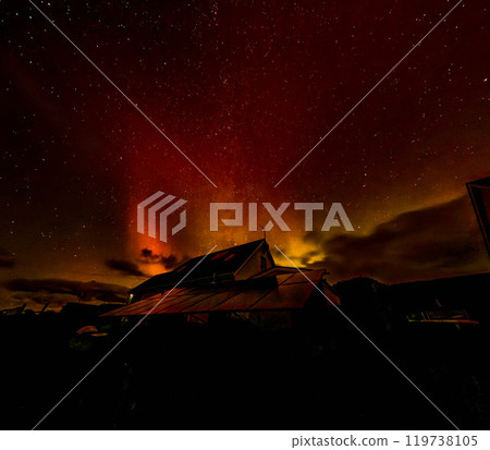 The Aurora Borealis, the northern lights, showing up above bungalow in County Donegal, Ireland The Aurora Borealis, the northern lights, showing up above bungalow in County Donegal, Ireland 119738105