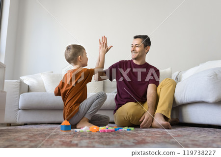 Happy proud dad and son kid making successful high five Happy proud dad and son kid making successful high five 119738227