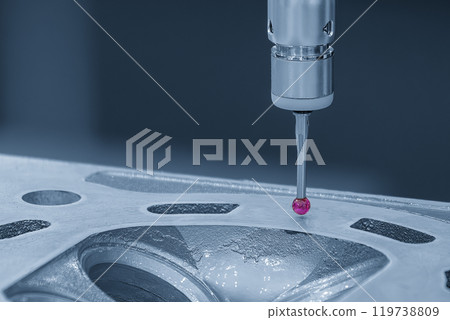 The CMM machine measuring the aluminum cylinder head parts in the light blue scene. 119738809