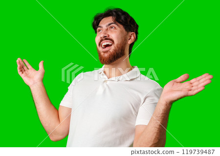 Young man expresses surprise in front of a bright green background Young man expresses surprise in front of a bright green background 119739487