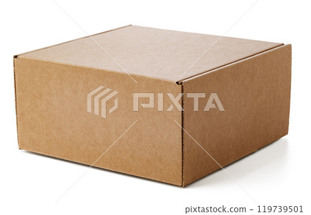 A plain cardboard box resting on a flat surface ready for shipping 119739501