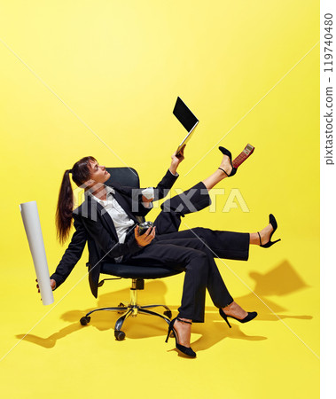 Creative collage. Businesswoman with multiple hands and legs sitting in office chair, skillfully juggling various office supplies like laptop, cup, and documents. Creative collage. Businesswoman with multiple hands and legs sitting in office chair, skillfully juggling various office supplies like laptop, cup, and documents. 119740480