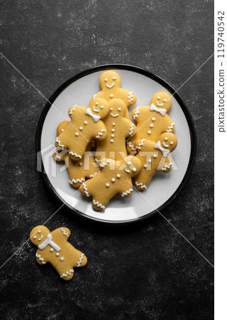 Christmas gingerbread man cookies over dark background, copy space. 119740542