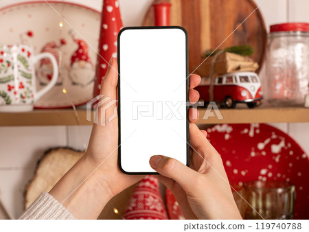 Hand holding mobile phone screen mockup, smartphone mock up, Christmas holiday and technology Hand holding mobile phone screen mockup, smartphone mock up, Christmas holiday and technology 119740788