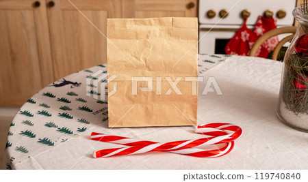 Christmas food delivery service. Paper bag mockup on table Christmas food delivery service. Paper bag mockup on table 119740840