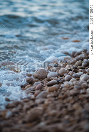 sea wave rolling on the rocks 119740943