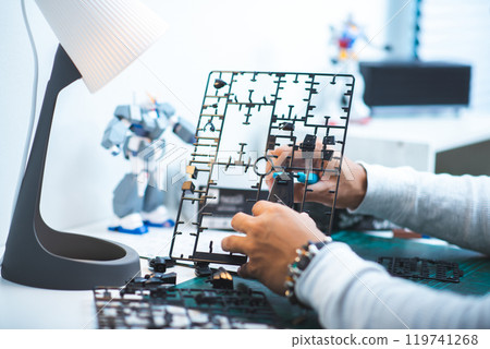 Assembling plastic model Assembling plastic model 119741268