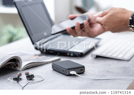 Charging the smartphone 119741314