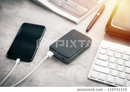 Charging the smartphone 119741316