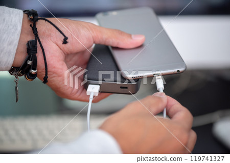 Charging the smartphone Charging the smartphone 119741327