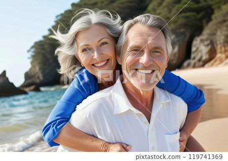 elderly couple walking at the beach 119741369