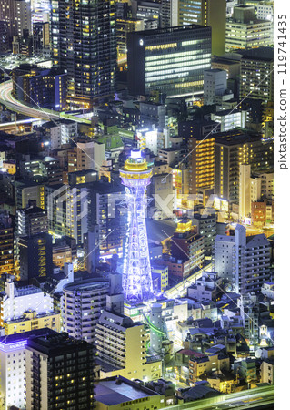 Osaka night view seen from Abeno Harukas Observatory: Tsutenkaku Tower shining brightly at night Osaka night view seen from Abeno Harukas Observatory: Tsutenkaku Tower shining brightly at night 119741435