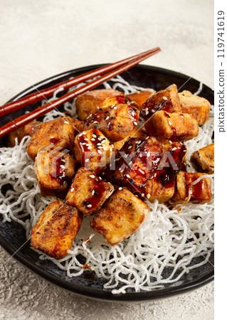 fried eggplant, with funchosa noodles, with teriyaki sauce and sesame seeds, homemade, no people fried eggplant, with funchosa noodles, with teriyaki sauce and sesame seeds, homemade, no people 119741619