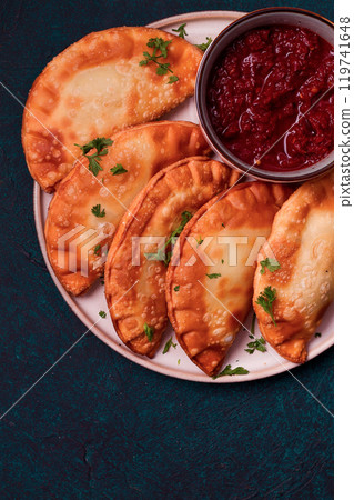 Fried mini pasties, with red sauce, top view, close-up, no people, selective focus, Fried mini pasties, with red sauce, top view, close-up, no people, selective focus, 119741648
