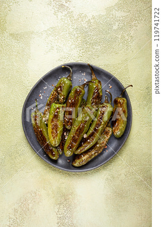 fried padron pepper, in a frying pan, with olive oil, and sea salt, homemade, no people. 119741722