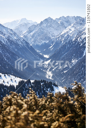 Vew from top of slope on snow capped mountains. Karakol ski resort in Kyrgyzstan 119741802