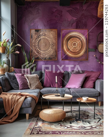 A cozy living room scene featuring a comfortable couch, cushions, and modern abstract wall art 119744263