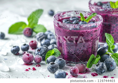 Fresh blueberry smoothies with mint garnish 119744403