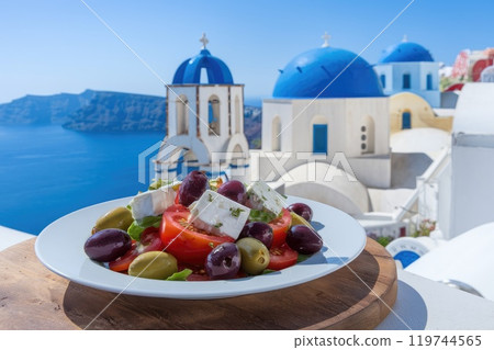 Greek salad overlooking the caldera in oia, santorini, greece Greek salad overlooking the caldera in oia, santorini, greece 119744565