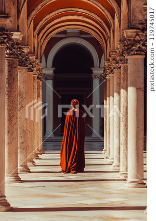 Beautiful woman in medieval dress walking among arched columns, colonnade Beautiful woman in medieval dress walking among arched columns, colonnade 119745017