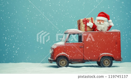 Santa Claus riding atop a red van with a large gift box, surrounded by a snowy scene and a blue sky backdrop 119745137