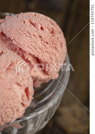 red strawberry-flavored ice cream in a glass bowl red strawberry-flavored ice cream in a glass bowl 119745791