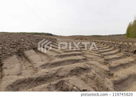plowed fertilized fertile soil for obtaining a new crop plowed fertilized fertile soil for obtaining a new crop 119745820
