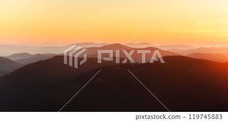 Beautiful orange sunset in high mountains 119745883