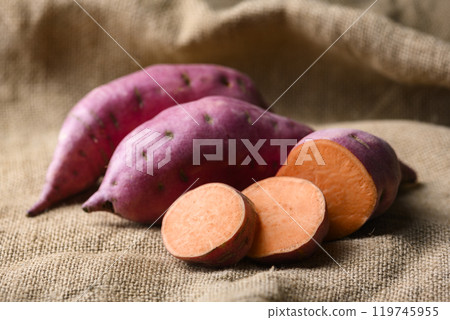 Pink organic raw sweet potatoes with orange flesh 119745955